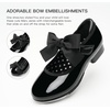 image:imageStelle Toddler Tap Shoes with Detachable BowToddlerLittle KidBig Kid  Detachable ribbon bow accentHookandloopSteel toe heel tapsCushioned insolePadded heel collarBlack